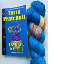 Terry Prachett book and variegated skein that matches the bright colors in the cover.