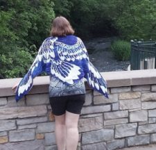 Feathery phoenix on triangular shawl