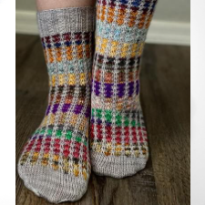Socks in two colors, a neutral and inch deep stripes.
