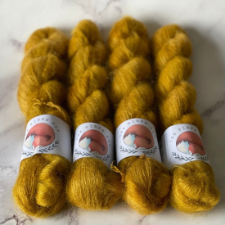 Mohair lace yarn in deep gold.