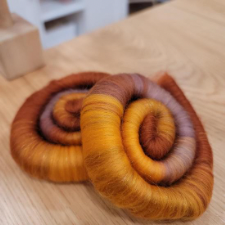 Coiled rolags in a toasty warm fall gradient.