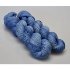 Blue jean color yarn with darker blue speckles.