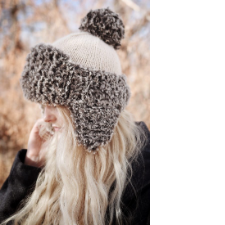 Knitted beanie with fluffy contrasting fold up brim and earflaps.