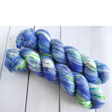 Deep periwinkle variegated yarn with splashes of white and lime green.