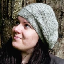 Slouchy hat with ribbed brim and horizontal bands of lace and texture.