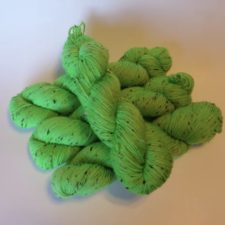 Bright apple green tweed yarns.