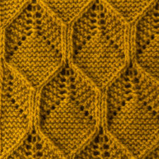 Overlaid hexagonal pattern done in both yarnovers and two-stitch cables.