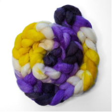 Braid of roving with variations of purple from vivid to nearly black, a bit of white, and a sunny gradient.
