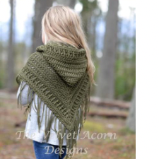 Crochet poncho with fringe and generous hood.