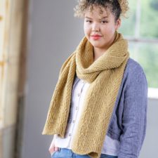 Scarf with wavy hem and subtle geometric textures.