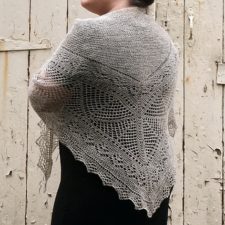 Lacy triangular shawl in a “woolly wool.”