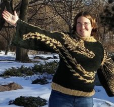 Dragon wraps around body of wide-sleeve sweater