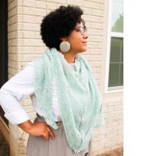 Eyelet and garter stitch triangular shawl has vintage feel.