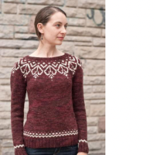Longsleeve boatneck pullover with delicate colorwork filagrees at the yoke and simpler colorwork at the hem and cuffs.