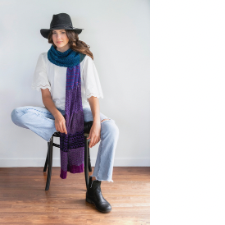 Long wrap or wide scarf in horizontal sections with varied colors and patterns.