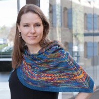 Top-down triangular shawl with yarnovers at the spine.