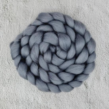Braided spinning fiber in neutral solid gray.