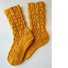 Cabled socks where the cables resemble narcissus blooms.