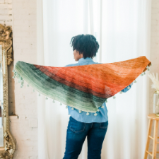 Shallow triangle shawl made with mini skeins, from tip to tip.