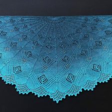 Half-circle shawl with geometric lace accented by beads