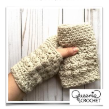 Fingerless mitts with bulky crochet texture.