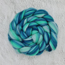 Braided spinning fiber in several shades of blue-green.