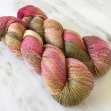 Variegated yarn in soft rose garden colors.