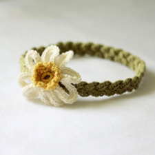 headband that looks braided, with crocheted daffodil