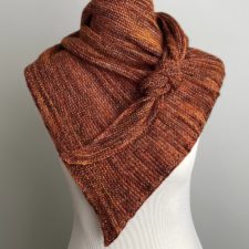 Asymmetric triangular shawl tied like a bandana.
