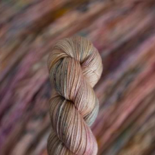 Gently variegated skein in warm, floral colors.