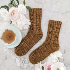 Socks with vertical textured stripes in moss stitch, openwork and more.