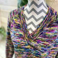 Simple V neck sweater with banded neck opening, in vivid variegated yarn.