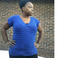 Short-sleeve V-neck crocheted tee.