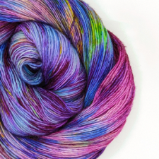 Single-ply variegated yarn in purples, pinks, greens and blues.