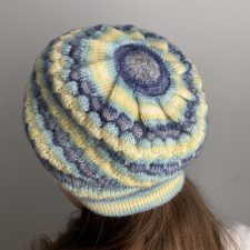 Slouchy beanie in slight bubble texture, made with self-striping yarn.