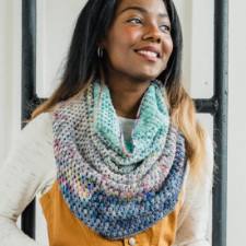 Tiny granny square stitches encircle this longer cowl, great for minis.