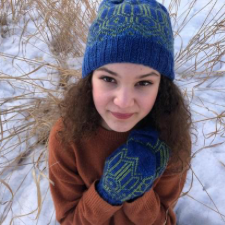 Beanie and mittens in two color geometric stranded colorwork.