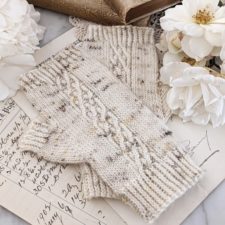 Fingerless Mitts with ribbing at all openings and a delicate braid up the top of each hand.
