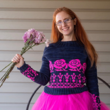 Two-color sweater with deep neutral and very bright, large rose motifs.