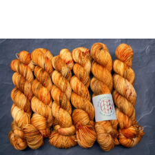 Tonal deep yellow orange yarn.