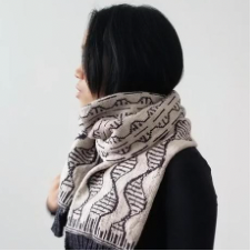 Colorwork scarf with double helix DNA motif.