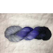 Gradient yarn in black to purple to deep silver.