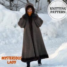 Long A-line coat with hood has contrasting edging like fur trim at all edges.