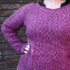 Longsleeve pullover with cables down each arm and intricate cables in a wide pattern down the front.
