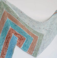 Shawl in five colors, angular patterns.