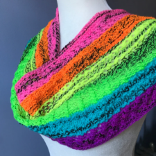 Circular-knit cowl with six knit and purl stripes in neon yarns.