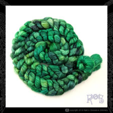 Coiled braid of tonal bright green fiber.