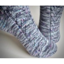 Chevron-style cables run up the sides of these socks.
