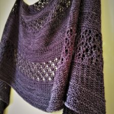 Still Moon is a top-down crescent shaped shawl featuring lace and two different slipped stitch textures.