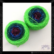 Long-change gradient yarn in cakes. Outer color is neon green.